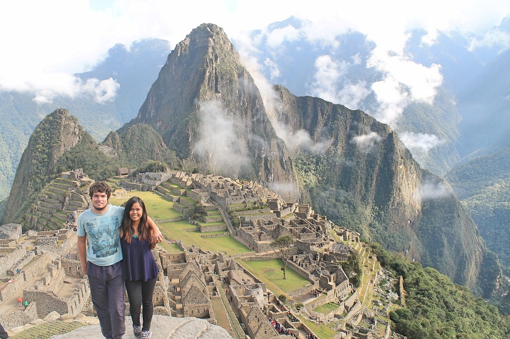 Exploring Wonder of the World Machu Picchu - Tourist Couple